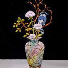 Blue Jay on flowers in vase