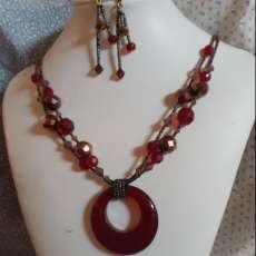 Faceted red and bronze glass bead necklace and matching earrings