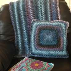 Multicolored throw and pillow set
