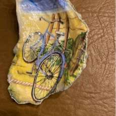 Oyster shell with summer scene and bicycle