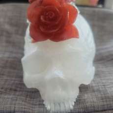 White skull with red flowers