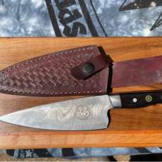 chefs knife and butcher block