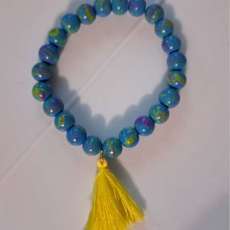 Splatter bead bracelet with tassel