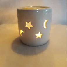 Free Stars & Moons Wax Warmer When you purchase 4 Pks Melts & 4 Pks Tea Lites
