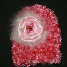 Fuzzy pink hat with handmade flower