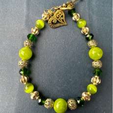 Jade bead bracelet with gold colored heart charm