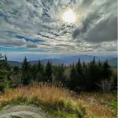 Sun Peeking through and Highlighting the Smoky Mountains
