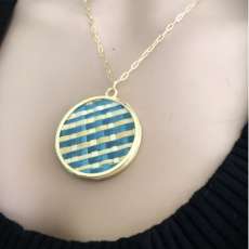 Necklace with unique handmade straw marquetry pendant.