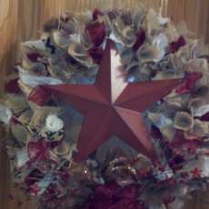 Burgundy based multi colored primitive metal Star burlap wreath
