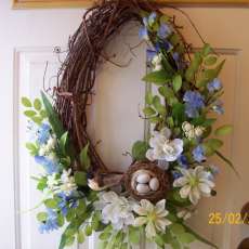 Large Oval Spring wreath in blue florals with birdsnest