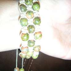 Green stone beads and beige wax cord