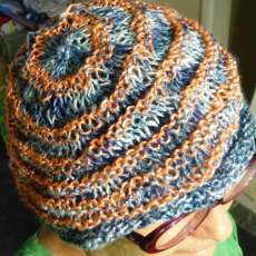 Hand knit linen hat in blue and coral