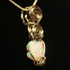 Opal, Ethiopian Welo in 14kt rolled gold wire wrap on chain