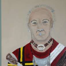 Portrait of "machu" in traditional Cherokee regalia.