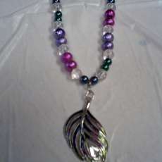 Glass bead necklace with feather metal pendant