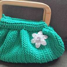 Wooden handle crocheted handbag